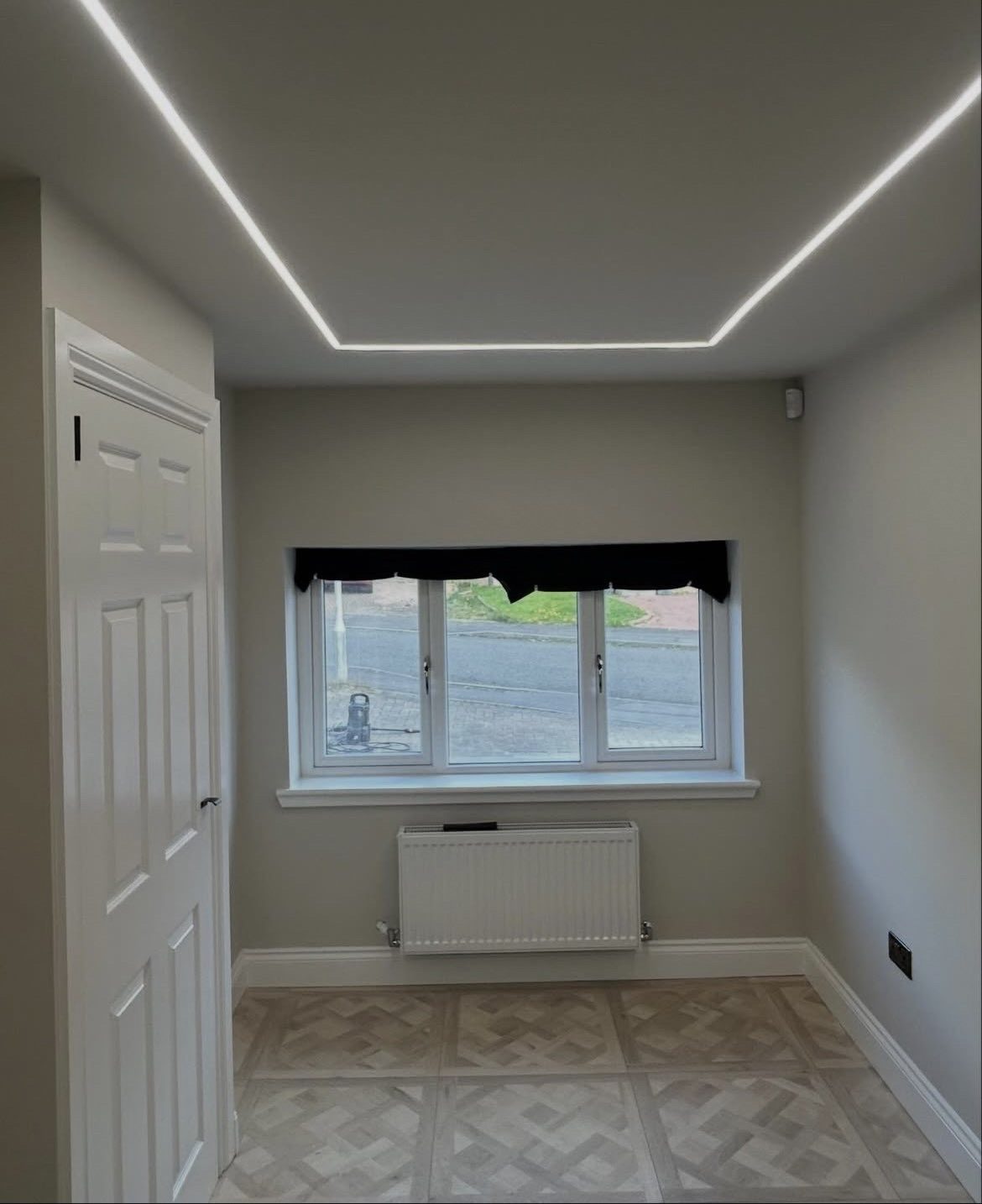 Garage conversion playroom with timber slat feature wall and aerial silk swing